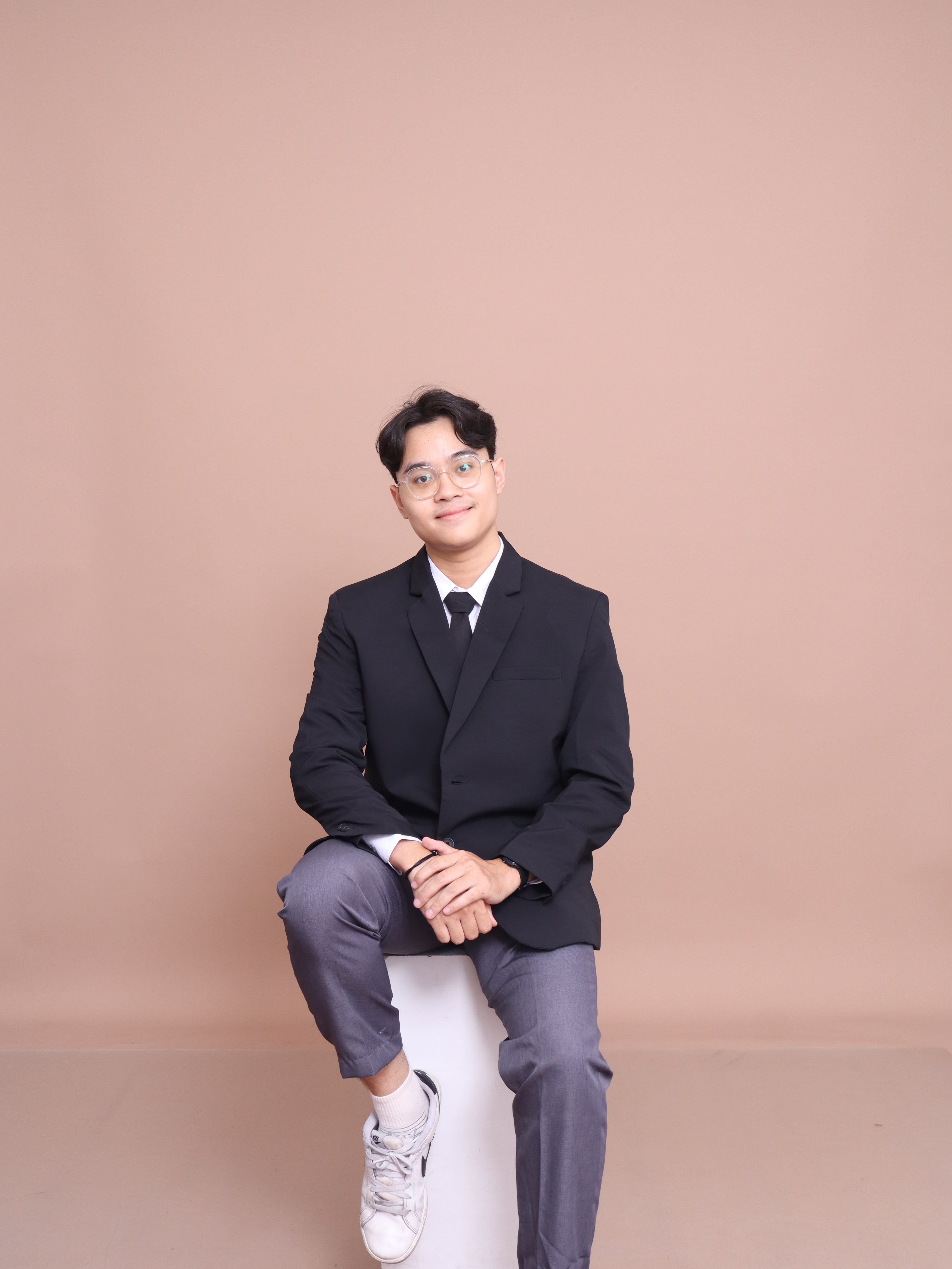 Jhoni Sitepu in a black suit